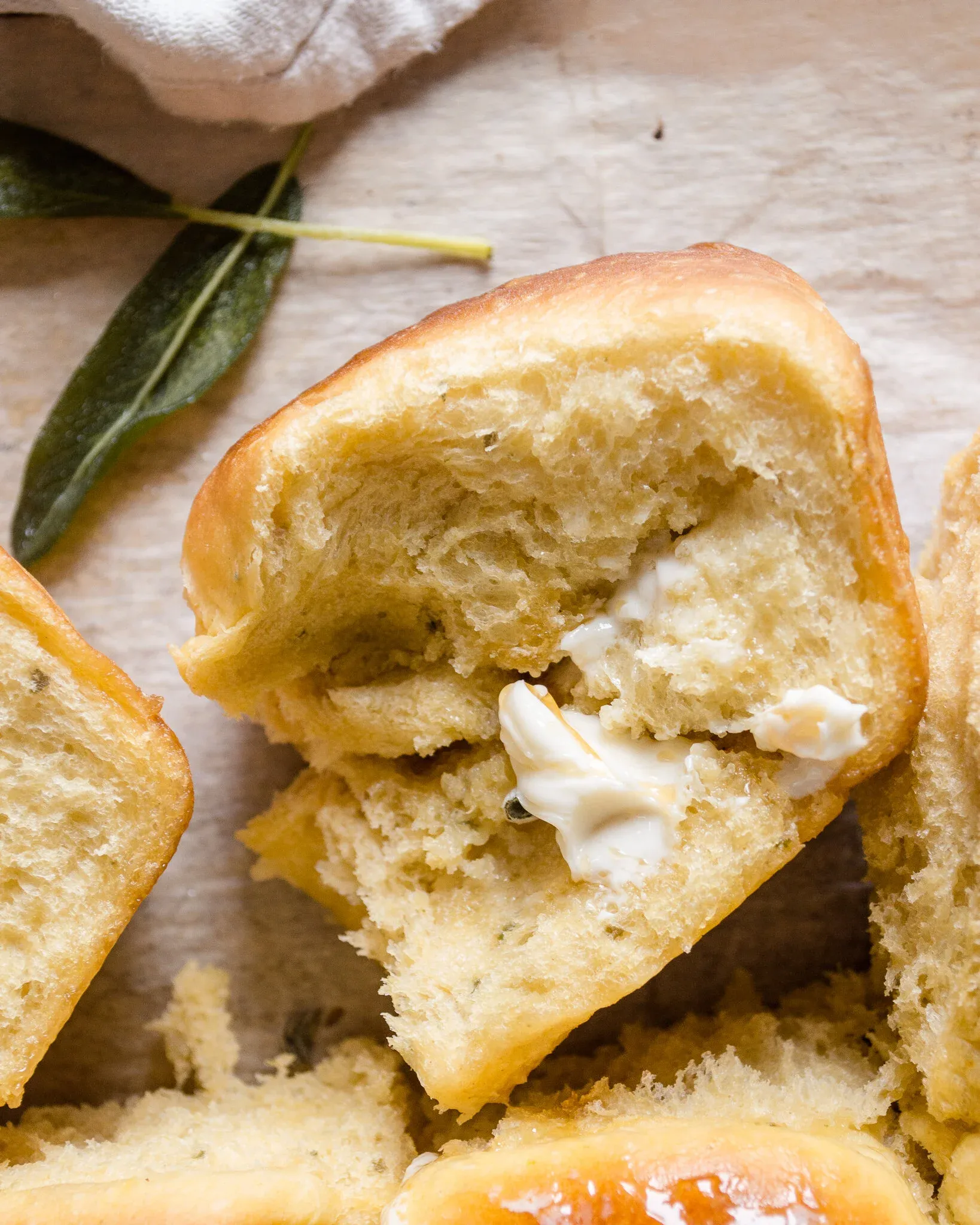 Honey bread roll torn open to reveal an airy